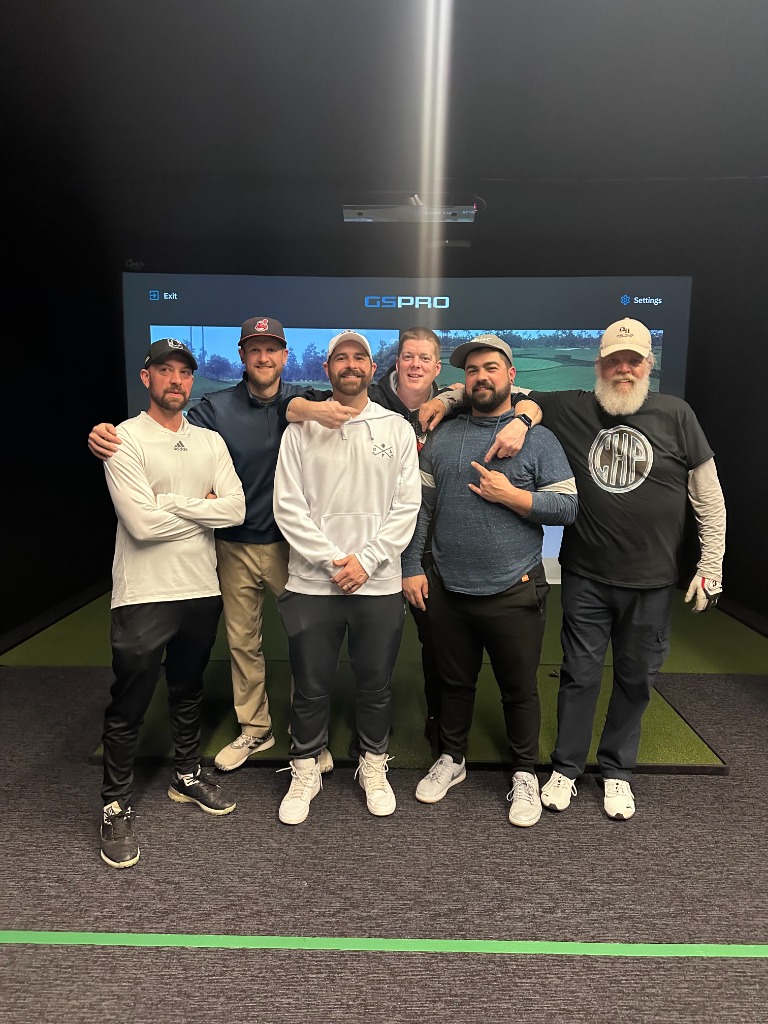 Group photo in simulator bay