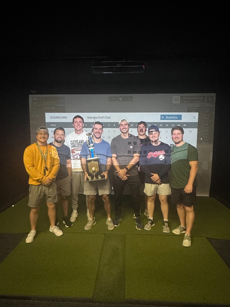 League group celebrating with trophy